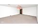 Spacious carpeted area in the basement features a Coca-Cola hanging light at 7245 Highburry Dr, Indianapolis, IN 46256