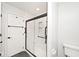 Bathroom with modern shower, glass door, and updated fixtures at 7245 Highburry Dr, Indianapolis, IN 46256