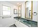 Bathroom vanity with double sinks, mirrors, and overhead lighting at 7245 Highburry Dr, Indianapolis, IN 46256