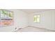 Sunlit bedroom with two windows and neutral carpet at 7245 Highburry Dr, Indianapolis, IN 46256