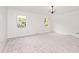 Bright bedroom with neutral carpet, two windows, and a decorative light fixture at 7245 Highburry Dr, Indianapolis, IN 46256