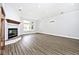 Bright living room with fireplace and hardwood floors offers a cozy atmosphere at 7245 Highburry Dr, Indianapolis, IN 46256
