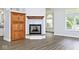 Charming living room with fireplace, built in storage, and natural light at 7245 Highburry Dr, Indianapolis, IN 46256