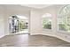 Bright living room with large windows and sliding glass door to patio at 7245 Highburry Dr, Indianapolis, IN 46256