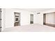 Bright living room with white carpet and wood burning fireplace visible through the doorway at 7245 Highburry Dr, Indianapolis, IN 46256