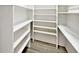 Walk-in pantry featuring wooden style floors and white shelving at 7245 Highburry Dr, Indianapolis, IN 46256