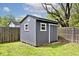 This storage shed features durable siding and windows, offering practical outdoor storage solutions at 7245 Highburry Dr, Indianapolis, IN 46256