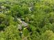 Lush greenery surrounds this home, as seen from an aerial perspective, highlighting the lot size at 7420 Denton Cir, Indianapolis, IN 46256
