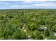 Beautiful aerial shot of a house nestled among mature trees, offering privacy and a serene setting at 7420 Denton Cir, Indianapolis, IN 46256