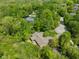 Aerial view of a quaint home featuring a private backyard and mature trees at 7420 Denton Cir, Indianapolis, IN 46256