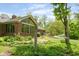 Picturesque backyard with a hammock strung between trees and garden beds at 7420 Denton Cir, Indianapolis, IN 46256