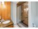 Modern bathroom features glass enclosed shower and granite topped vanity at 7420 Denton Cir, Indianapolis, IN 46256