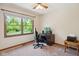 A home office or bedroom with a large window and a desk at 7420 Denton Cir, Indianapolis, IN 46256