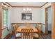 Charming dining room with wood trim, natural light, and seating for six at 7420 Denton Cir, Indianapolis, IN 46256