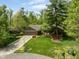 Beautiful aerial view of a home with a well-manicured lawn, brick exterior, and mature trees at 7420 Denton Cir, Indianapolis, IN 46256