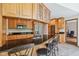 Spacious kitchen featuring granite counters, stainless appliances, ample cabinetry, and tile flooring for cooking and gathering at 7420 Denton Cir, Indianapolis, IN 46256