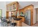 Well-equipped kitchen featuring stainless steel appliances, granite countertops, and wooden cabinetry at 7420 Denton Cir, Indianapolis, IN 46256