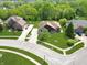 Birds-eye view of the house in a lush, green community with mature trees and landscaping at 7665 Stones River Ct, Indianapolis, IN 46259