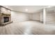 Finished basement with brick fireplace and new hardwood floors at 7665 Stones River Ct, Indianapolis, IN 46259