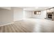 Spacious finished basement featuring brick fireplace, hardwood floor and recessed lighting at 7665 Stones River Ct, Indianapolis, IN 46259