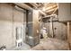 Basement utility area with HVAC system and storage containers at 7665 Stones River Ct, Indianapolis, IN 46259