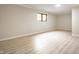 Finished basement space featuring new flooring and a window for natural light at 7665 Stones River Ct, Indianapolis, IN 46259