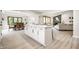 Open-concept kitchen with an island, seamless flow to dining & living space, and modern finishes at 7665 Stones River Ct, Indianapolis, IN 46259