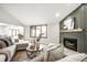 Inviting living room with a fireplace, large windows, and comfortable seating at 7665 Stones River Ct, Indianapolis, IN 46259