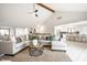 Open-concept living room with a view of the kitchen and dining area at 7665 Stones River Ct, Indianapolis, IN 46259