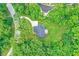 Aerial view of a beautiful home surrounded by verdant trees, set on a spacious lot at 7716 Traders Hollow Ln, Indianapolis, IN 46278