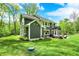 Spacious backyard with patio area, perfect for outdoor entertaining, and plenty of green space at 7716 Traders Hollow Ln, Indianapolis, IN 46278