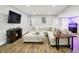 Comfortable basement featuring a large sectional sofa, entertainment center, and a decorative fish tank at 7716 Traders Hollow Ln, Indianapolis, IN 46278
