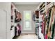 Spacious walk-in closet with custom shelving and storage solutions, providing ample space for clothes and accessories at 7716 Traders Hollow Ln, Indianapolis, IN 46278