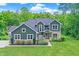 Charming two-story home with a well-manicured lawn, stone accents, and inviting curb appeal at 7716 Traders Hollow Ln, Indianapolis, IN 46278