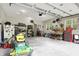 Spacious garage with ample storage, work area, tools, equipment and natural light from the windows at 7716 Traders Hollow Ln, Indianapolis, IN 46278