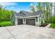 A modern two-car garage that matches the style of the rest of the beautiful home at 7716 Traders Hollow Ln, Indianapolis, IN 46278