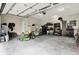 Spacious garage with ample storage, work area, tools, and equipment for various projects and hobbies at 7716 Traders Hollow Ln, Indianapolis, IN 46278