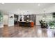 Kitchen with a large central island, stainless steel appliances, and open floorplan at 7716 Traders Hollow Ln, Indianapolis, IN 46278