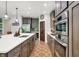 Bright, open kitchen with a large island, stainless steel appliances, and modern cabinetry at 7716 Traders Hollow Ln, Indianapolis, IN 46278