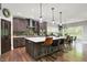 Beautiful kitchen featuring a large island, stainless appliances, and pendant lighting at 7716 Traders Hollow Ln, Indianapolis, IN 46278