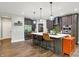Open-concept kitchen with island, stainless steel appliances, and modern finishes at 7716 Traders Hollow Ln, Indianapolis, IN 46278
