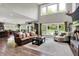 Bright living room with cathedral ceiling, hardwood floors, and a stone fireplace at 7716 Traders Hollow Ln, Indianapolis, IN 46278