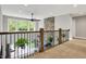 Upper level loft with modern railing overlooking the main level, and lots of natural light at 7716 Traders Hollow Ln, Indianapolis, IN 46278