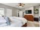 Comfortable bedroom with a large bed, dresser, and ample space for relaxation at 7716 Traders Hollow Ln, Indianapolis, IN 46278
