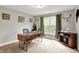 Comfortable home office space featuring a natural wood desk, and a bright window with natural light at 7716 Traders Hollow Ln, Indianapolis, IN 46278