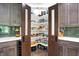 Well-stocked pantry with custom shelving and storage solutions, conveniently located near the kitchen at 7716 Traders Hollow Ln, Indianapolis, IN 46278