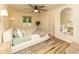 The main bedroom offers a serene space with neutral tones, wood flooring, and large windows at 780 Wilson Terrace Ct, Carmel, IN 46032