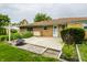 Backyard featuring brick home, patio, landscaping, and plenty of space for outdoor enjoyment at 8103 Rumford Rd, Indianapolis, IN 46219