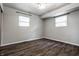 Bright bedroom with hardwood flooring and two windows that provide natural light at 8103 Rumford Rd, Indianapolis, IN 46219