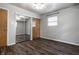 Bedroom featuring a mirrored closet and hardwood flooring at 8103 Rumford Rd, Indianapolis, IN 46219